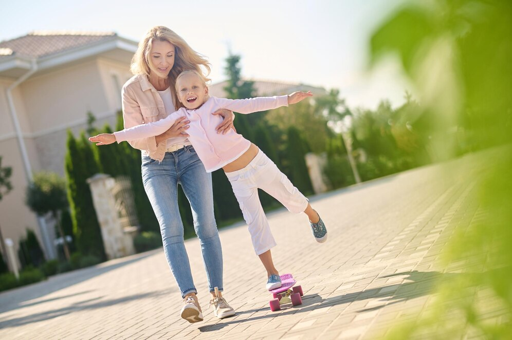 Mom and daughter skateboarding